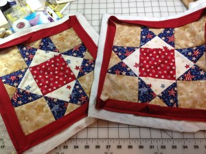 Ohio Star blocks 12.5" quilted and bound. Just hand stitching left.