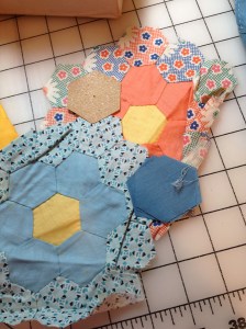 sandpaper template and unfinished hexie pieces