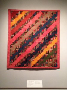 Another variation of a Log Cabin Quilt - uses the traditional red center square to represent the hearth.